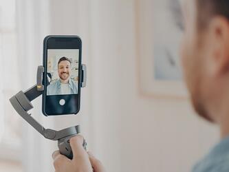 person filming themselves using smartphone